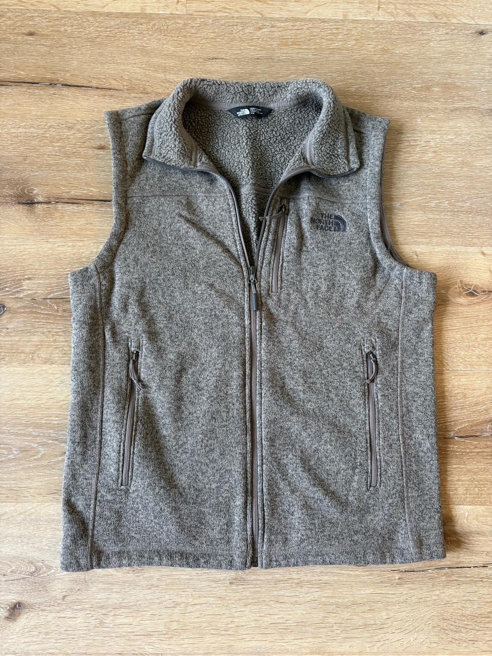 The North Face Men’s Brown Fleece Vest with zippered pockets